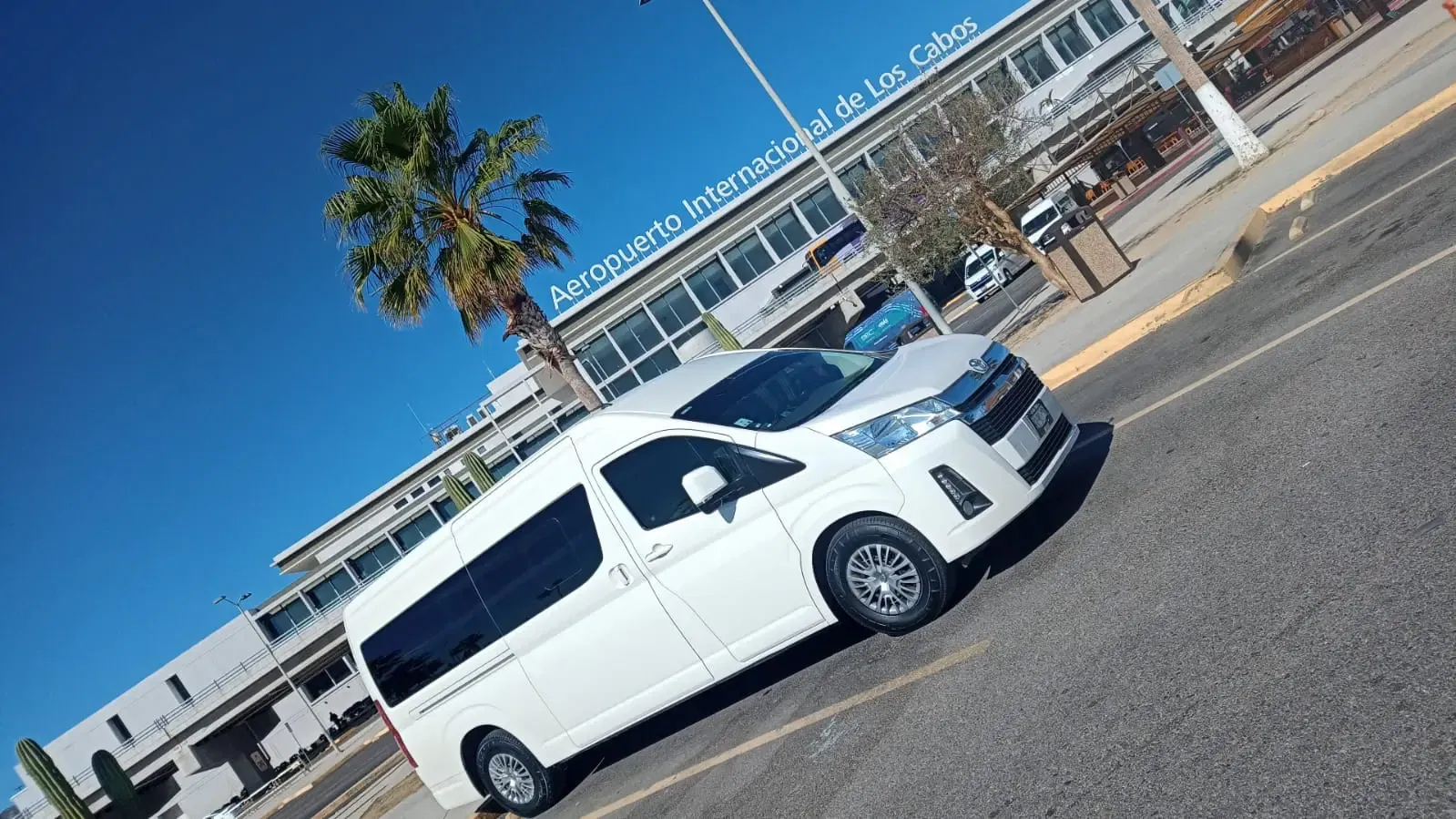 White Van Parked Outside Aeropuerto Internacional de los cabos Terminal 2