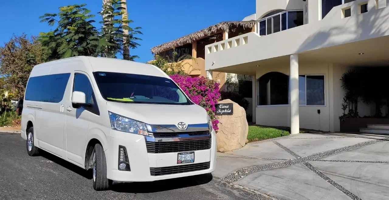 los cabos airport shuttles white van 2024 for large groups parked outside Casa Sophia at cabo san lucas.